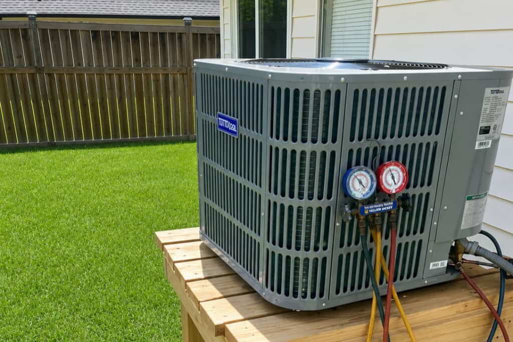 new ac unit installed on side of the house